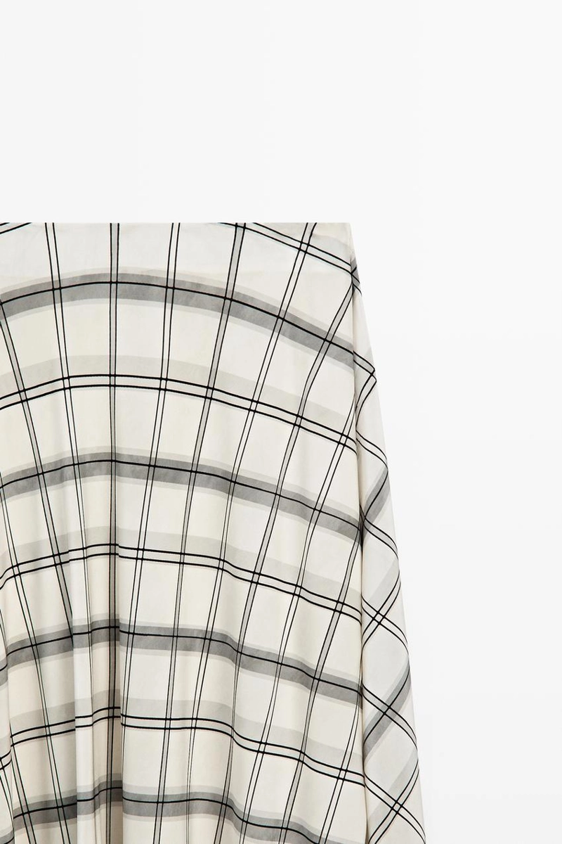 Асимметричная юбка миди с клетчатым узором
